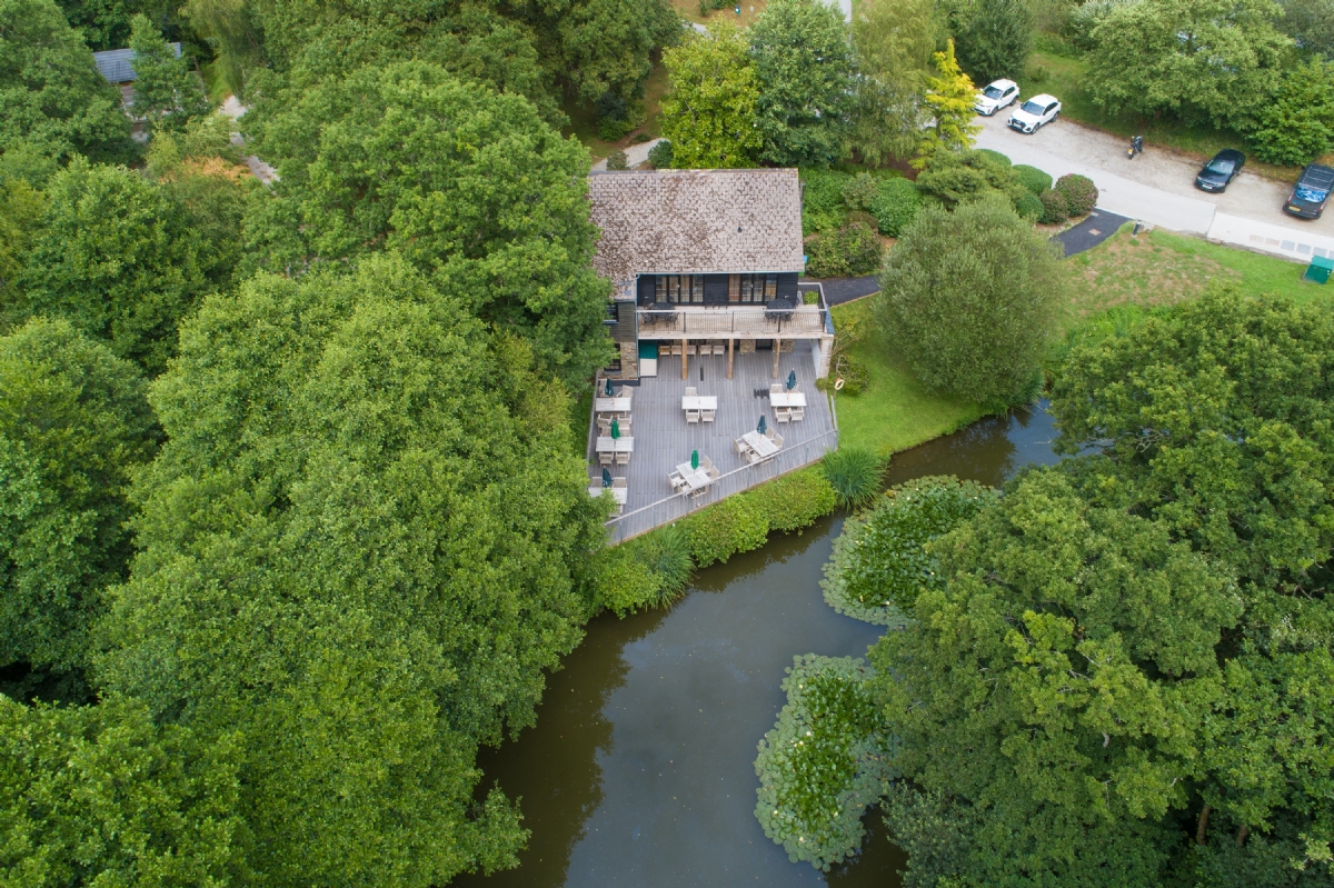 The Old Mill and its lakeside terrace at Stonerush Lakes, seen from above